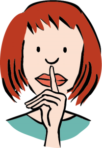 Eine Frau legt den Finger an ihren Mund. Schweigen.
